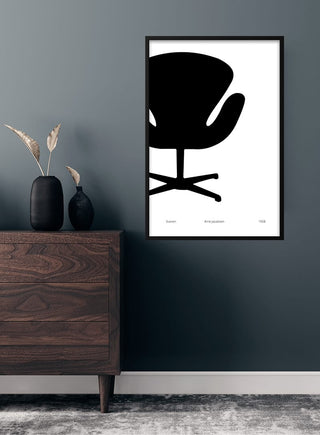 Poster of Arne Jacobsen's Swan chair in black and white, framed and hanging in a modern living room.
