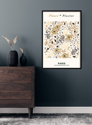 Framed Fleurs et Plantes Paris #3 art print with floral illustration, displayed on a dark wall above a wooden dresser.
