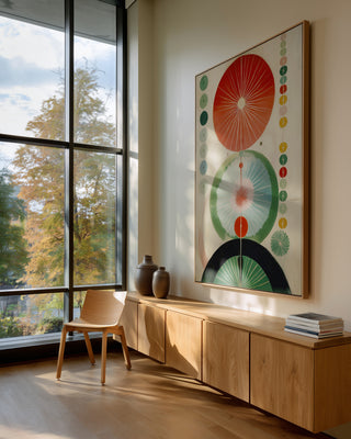 Green Hilma No. 2 poster in a light oak frame above an oak sideboard by a large window.