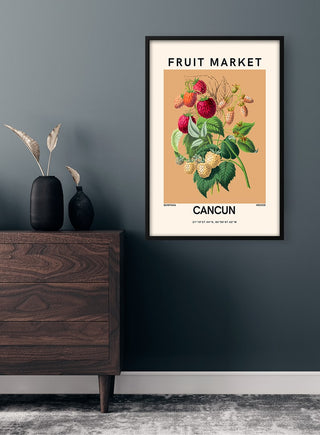 Fruit Market - Cancun poster with vintage fruit illustration hanging on a wall above a wooden drawer.