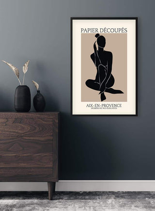 French papier decoupe art poster featuring a minimalist cut-out silhouette, framed on a modern interior wall.