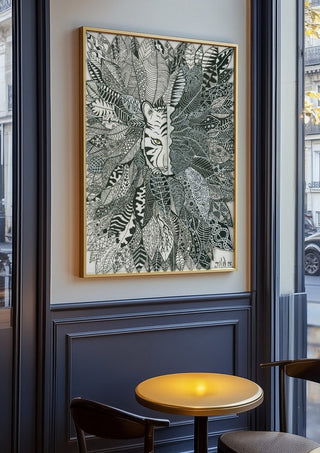 Tiger in the Leaves by JHN.ByHjort in an oak frame on a panelled café wall