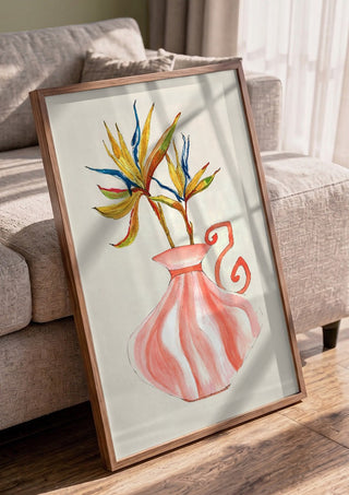 Bird of paradise by Marjorie Salvagni in a walnut frame leaning against a grey sofa