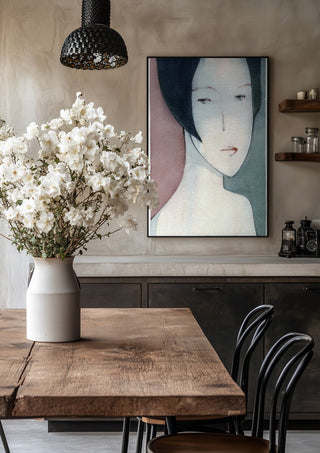 A Child by Designus in a black frame above a rustic table with white flowers