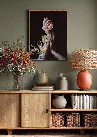 Hypnopompic by Rocio Montoya above a wooden sideboard on a sage green wall