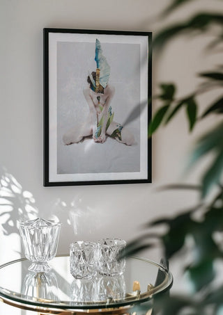 Letargo I by Rocio Montoya in a black frame above a glass table with crystal glassware