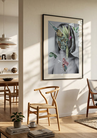 The color of fresh roses by Rocio Montoya in a black frame in a bright dining room with wooden chairs