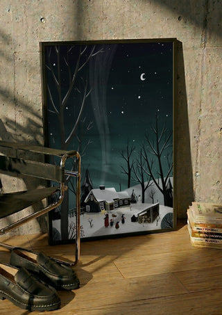 winter night by Justyna in a black frame leaning against a concrete wall by a steel chair