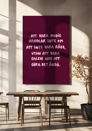 Modig by Grafik bageri hanging above a wooden dining table in warm sunlight