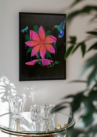 Flora e Fauna by KG Studio in a black frame above a glass table with crystal glassware