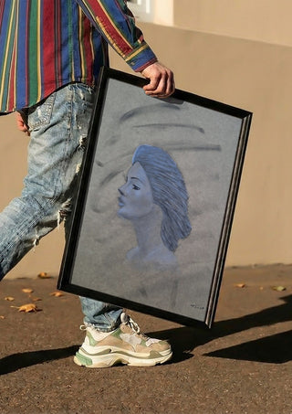 Blue Profile by Allheartsportraits carried in a black frame along a sunny street