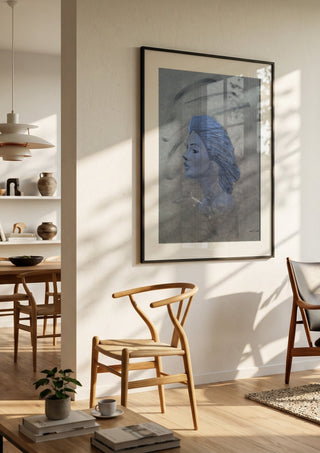 Blue Profile by Allheartsportraits in a black frame in a bright dining room with wooden chairs