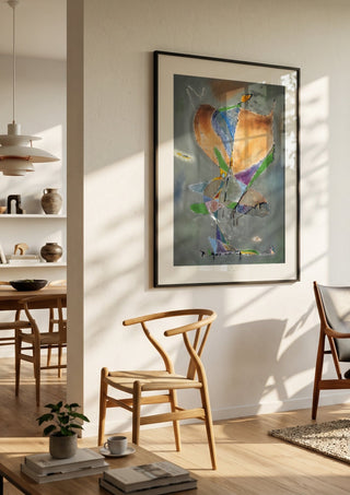 Butterfly by Art Guveau in a black frame in a bright dining room with wooden chairs