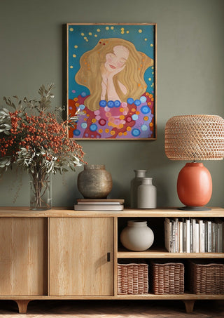 The dreamer by Gerard Ceulemans above a wooden sideboard on a sage green wall