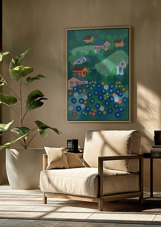 View from above by Gerard Ceulemans framed above a beige armchair beside a potted plant