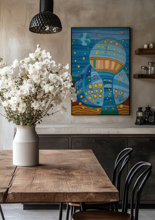 Once upon a blue moon by Gerard Ceulemans in a black frame above a rustic table with white flowers