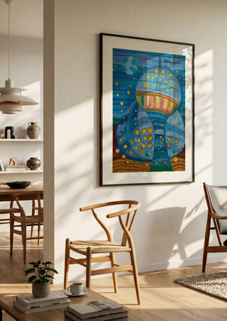 Once upon a blue moon by Gerard Ceulemans in a black frame in a bright dining room with wooden chairs