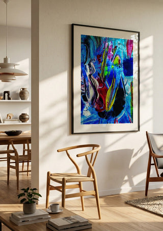 Abstract in perfection 2 by Walter Zettl in a black frame in a bright dining room with wooden chairs