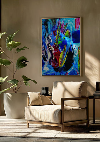 Abstract in perfection 2 by Walter Zettl framed above a beige armchair beside a potted plant