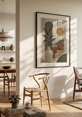 Bohemian Botanical Harmony – Terracotta & Sage Green by TimlessArtworks in a black frame in a bright dining room with wooden chairs