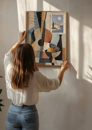 Bohemian String Instrument Still Life – Earthy Tones & Coastal Scene by TimlessArtworks being hung on a sunlit wall