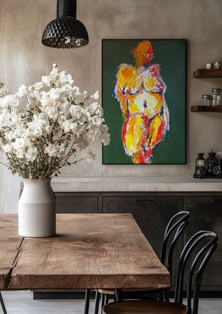Standing Nude by René J in a black frame above a rustic table with white flowers