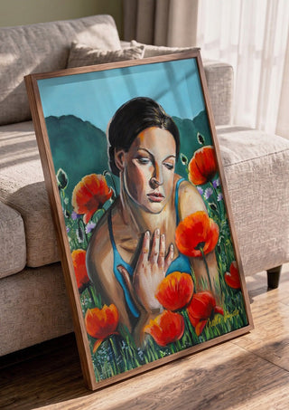 A Moment of Stillness by Nella Hajdu in a walnut frame leaning against a grey sofa