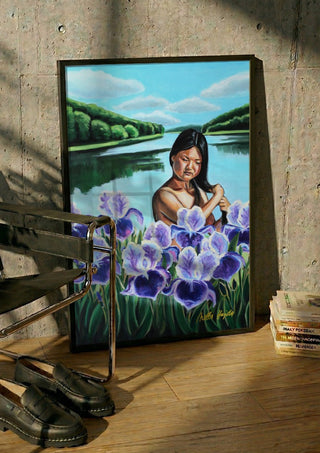 Awakening by Nella Hajdu in a black frame leaning against a concrete wall by a steel chair