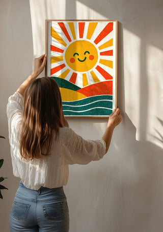 Smiling Sun by Decker Studios being hung on a sunlit wall