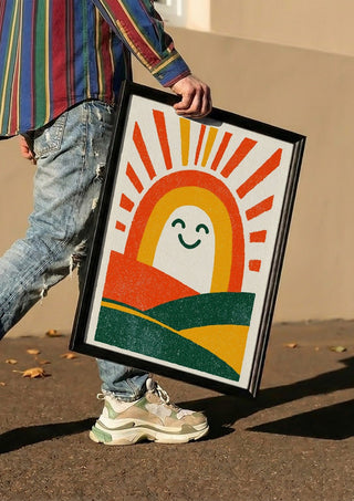 Sunrise Arch by Decker Studios carried in a black frame along a sunny street