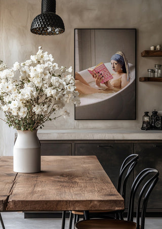 Chillin Time by Dikhotomy in a black frame above a rustic table with white flowers