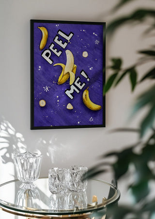 Peel me! by KG Studio in a black frame above a glass table with crystal glassware