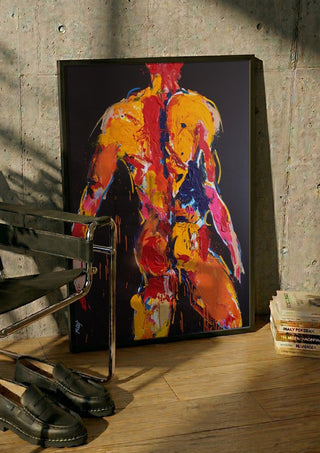 Back in Yellow by René J in a black frame leaning against a concrete wall by a steel chair