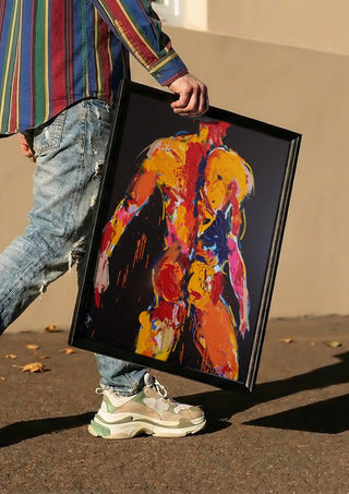 Back in Yellow by René J carried in a black frame along a sunny street