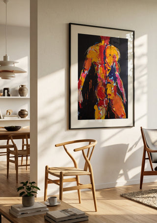 Back in Yellow by René J in a black frame in a bright dining room with wooden chairs