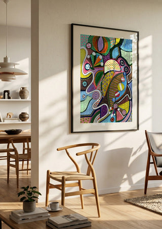 Peaceful Power by LGDyrby in a black frame in a bright dining room with wooden chairs