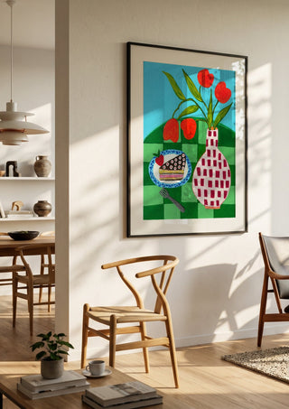 Sweet Afternoon by LGDyrby in a black frame in a bright dining room with wooden chairs