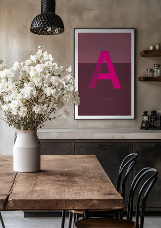 A as in Awesome – Cerise by Quite Nice Prints in a black frame above a rustic table with white flowers