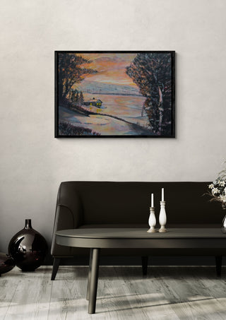 A Winter Retreat by Finbar Stevens in a black frame above a dark sofa with candlesticks and a vase