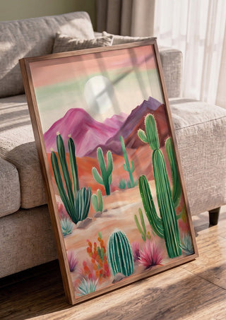 Cactus desert by Ohkimiko in a walnut frame leaning against a grey sofa