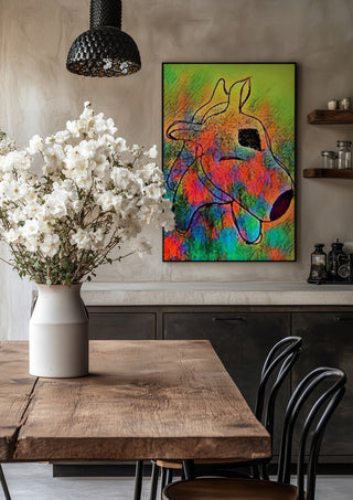 Color Pitbull by Nittaart in a black frame above a rustic table with white flowers