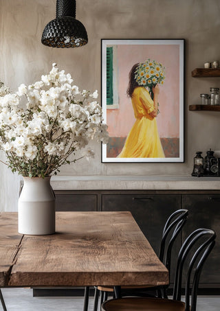 Girl in yellow dress with flowers by Ohkimiko in a black frame above a rustic table with white flowers