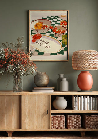 Buon Appetito by ThingDesign above a wooden sideboard on a sage green wall