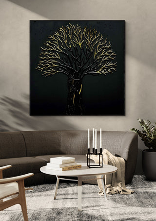 The Golden Tree by Marcel Herrmann in a black frame above a curved grey sofa with candlesticks on a round table