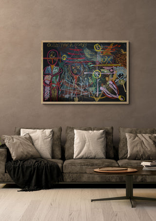 Alles nach Maß by Ali Kasap in a light oak frame above a grey sofa on a warm brown wall