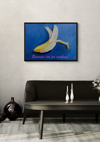 Bananas are for monkeys! by creatievananne in a black frame above a dark sofa with candlesticks on a round table