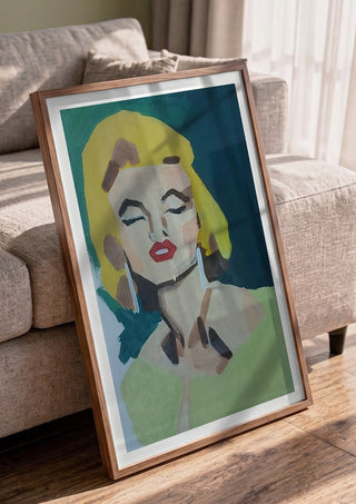 Marilyn Monroe by creatievananne in a walnut frame leaning against a grey sofa