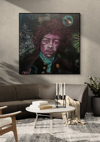 Jimi Hendrix by creatievananne in a black frame above a dark sofa with candlesticks on a round table