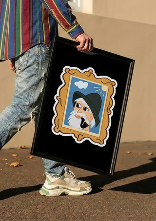 Old Fisherman by KaroGaiaArt carried in a black frame along a sunny street