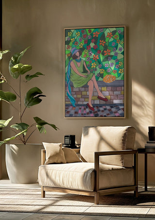 The Garden Wall by Camilla Nilsson framed above a beige armchair beside a potted plant